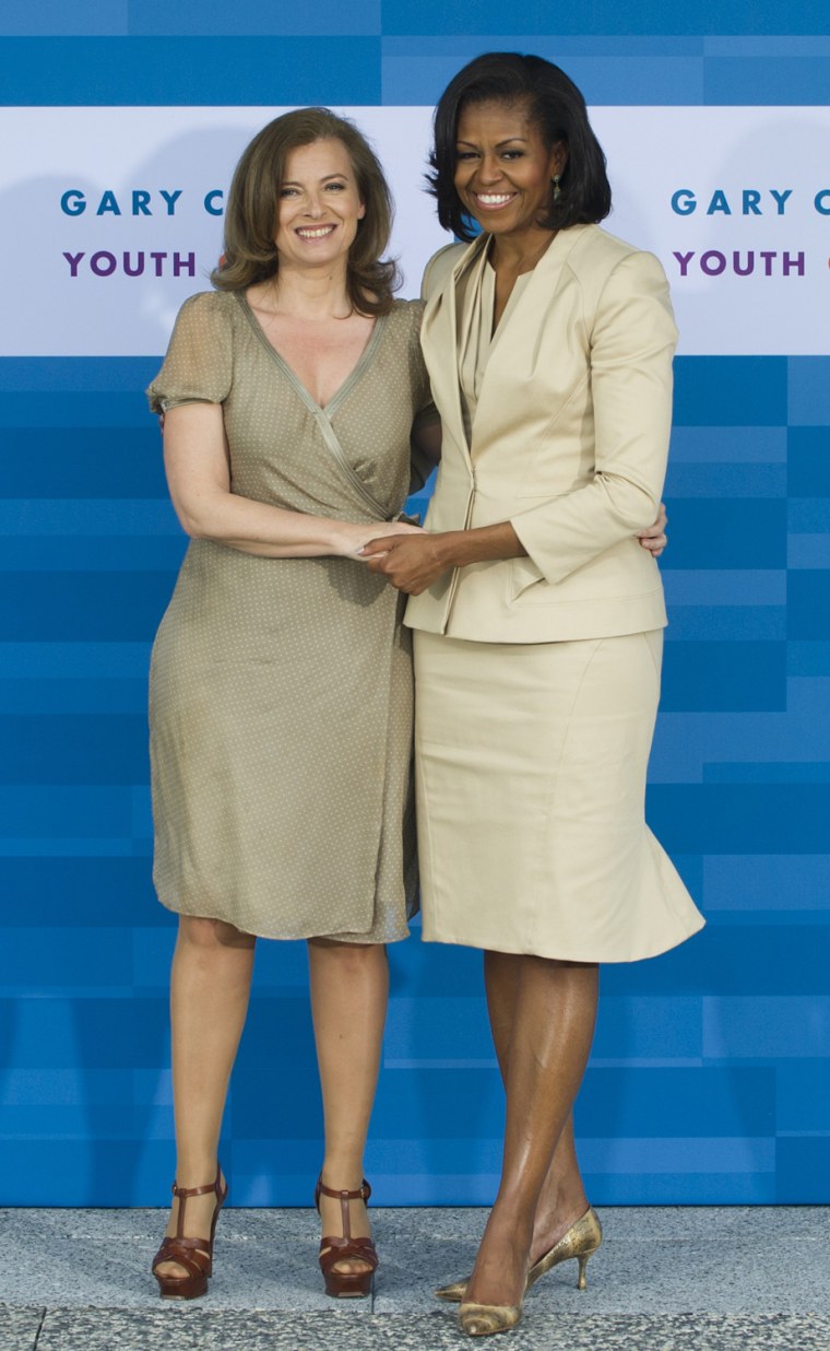 US First Lady Michelle Obama (R) greets